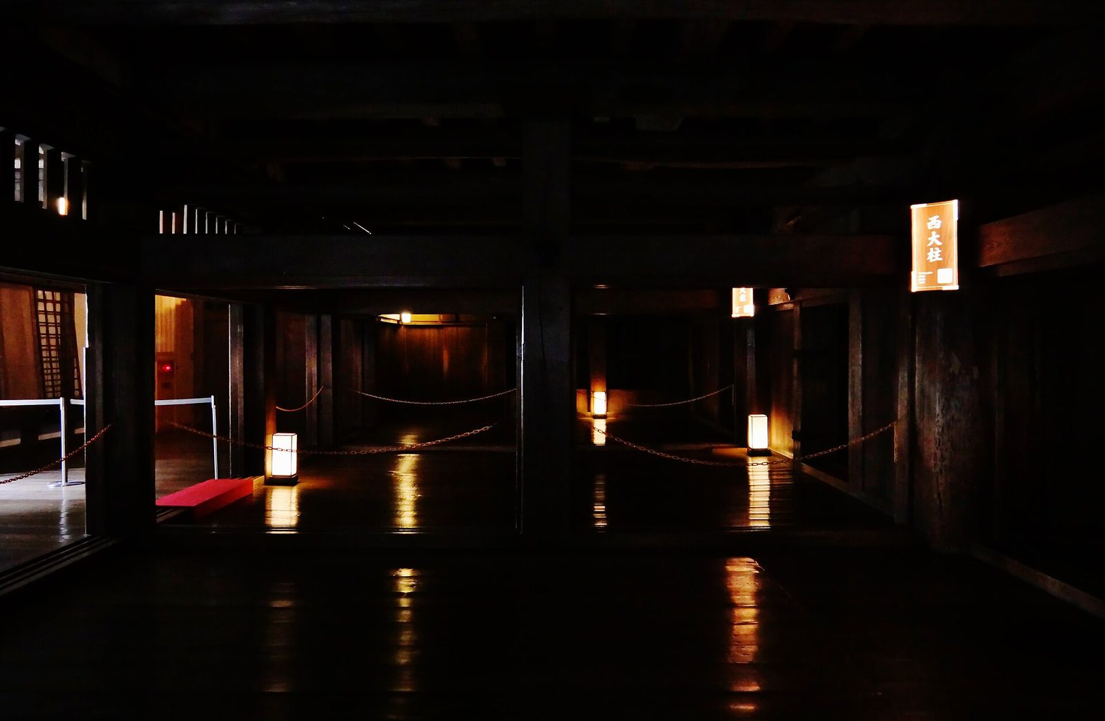Massive timber pillars and beams inside the keep of Himeji Castle