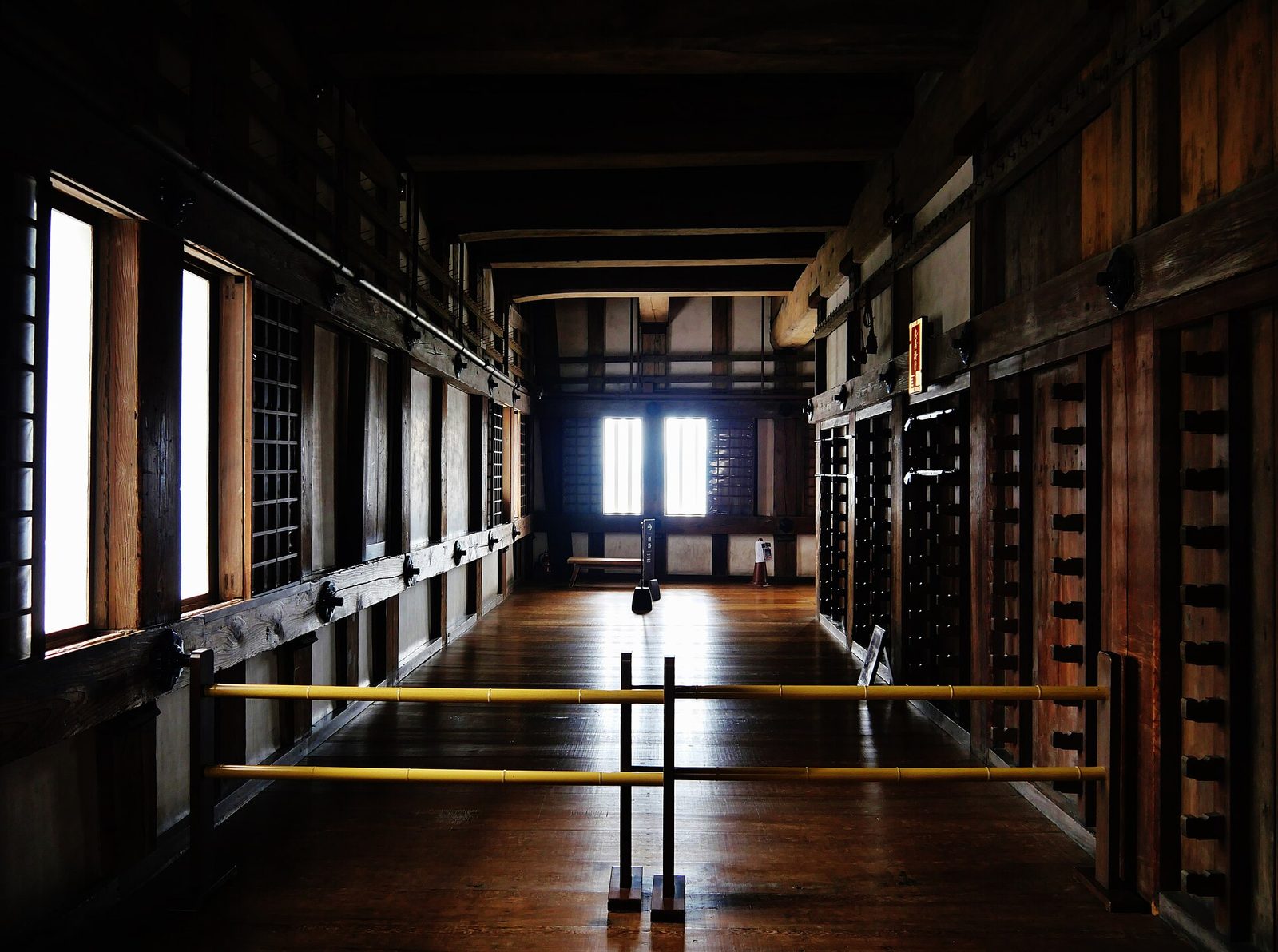 Steep wooden stairway between floors inside the keep